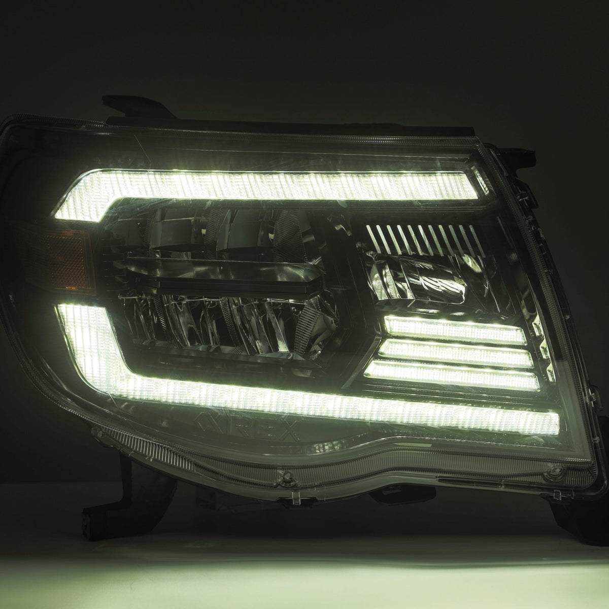 AlphaRex 880735 05-11 Toyota Tacoma LUXX Crystal Headlights Plank Style Design Black with Activation Light/DRL