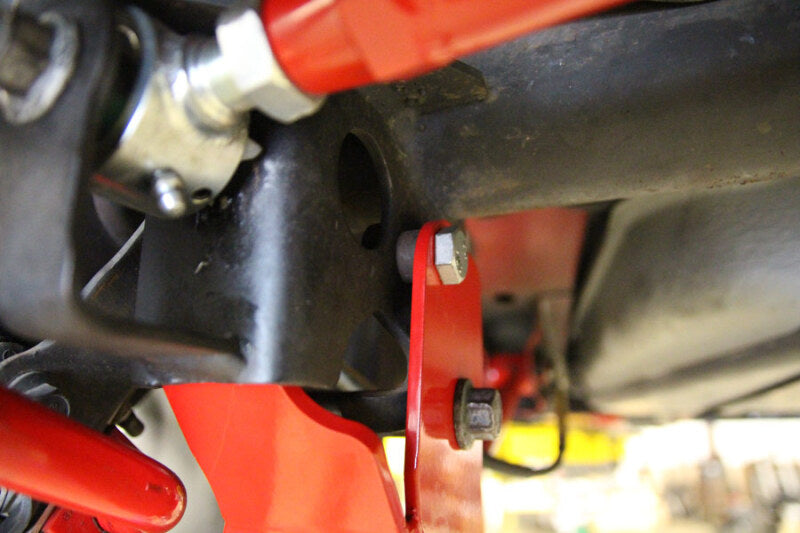 UMI Performance 1060-R Rear Control Arm Relocation Brackets Bolt-In Red