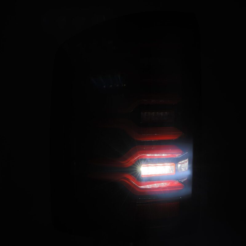 AlphaRex 630050 14-18 GMC Sierra 1500/2500 HD/3500 HD LUXX-Series LED Tail Lights Black/Red w/Activation Light Sequential Signal