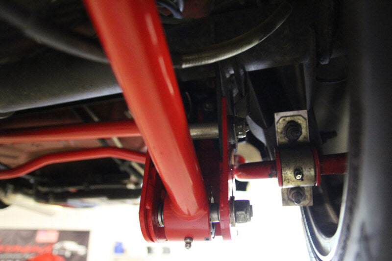 UMI Performance 1060-R Rear Control Arm Relocation Brackets Bolt-In Red